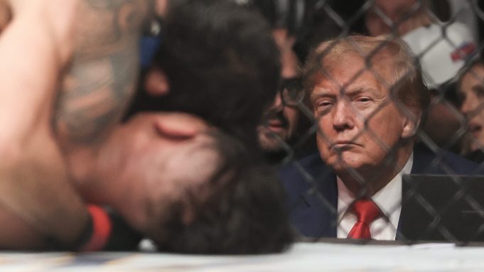 Donald Trump watches the flyweight title fight between Alexandre Pantoja and Brandon Royval during the UFC 296: Edwards vs. Covington event on Dec. 16, 2023 in Las Vegas, Nevada.